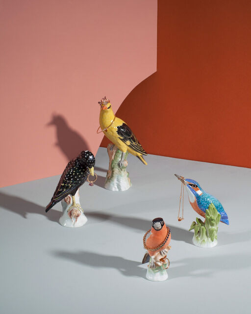 Special KPM pieces combined with jewellery from Wempe jewellery Four different KPM porcelain birds wearing rings, bracelets and a chain by Wempe