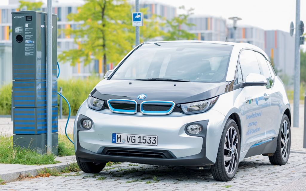 Electric car charging at charging station